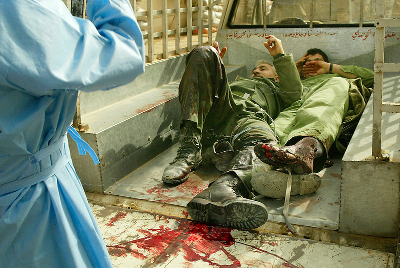 Baghdad, Iraq, April 5, 2003.Wounded Iraqi soldiers rushed to Al Kindi hospital on the back of a pick-up truck. More than 70 US bombardment victims were admitted in less than 2 hours after a B52 carpet bombing on the Northern outskirts, about a fifth of these were military personel.