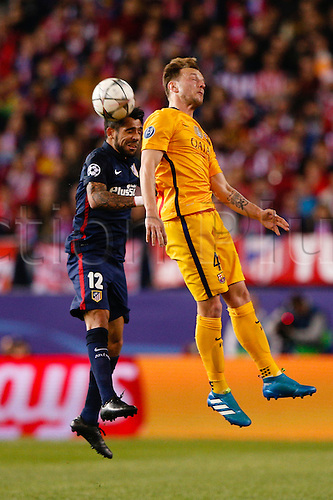 13.04.2016. Madrid, Spain. Augusto Fernandez (12) Atletico de Madrid and Ivan Rakitic (4) FC Barcelona. UCL Champions League between Atletico de Madrid and FC Barcelona at the Vicente Calderon stadium in Madrid, Spain, April 13, 2016 .