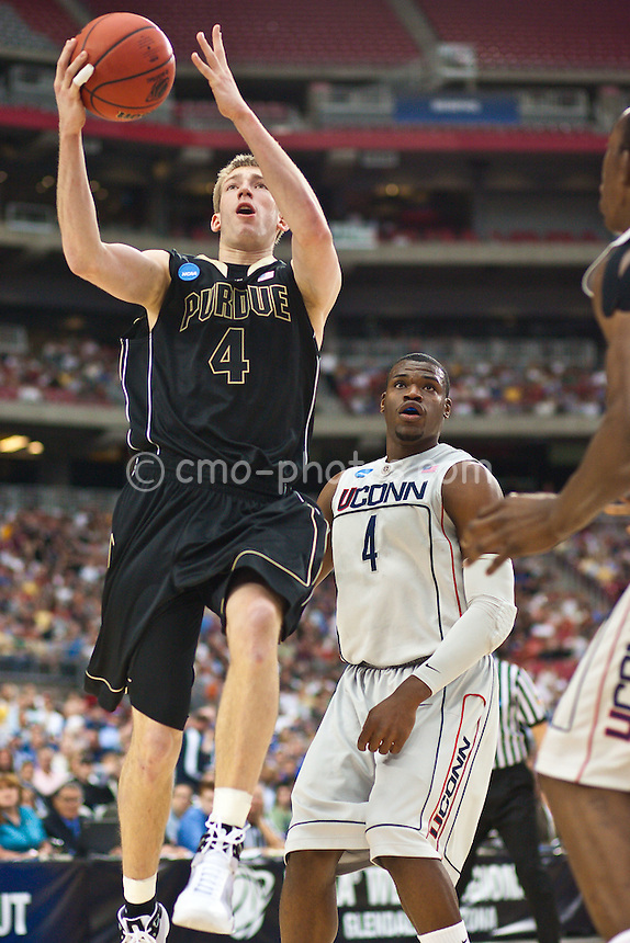 Mar 26, 2009; Tucson, AZ, USA; Purdue Boilermakers forward Robbie Hummel (4) goes up for a layup in front of Connecticut Huskies forward Jeff Adrien (4) in the first half of a game in the semifinals of the west region of the 2009 NCAA basketball tournament at University of Phoenix Stadium.