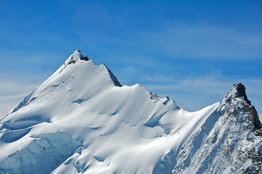 Razor sharp summit ridge on the Weisshorn mountain in the Swiss Alps