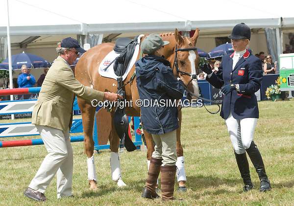 ZARA PHILLIPS IA HELPED BY MOTHER PRINCESS ANNE AND FATHER MARK PHILLIPS TO UNSADDLE TOYTOWN.Zara fought back tears during her farewell to her favourite horse "Ginger" Toytown at the Gatcombe Horse Trials, Minchinhampton, Glos._07/08/2011.Mandatory Credit Photo: ©Francis Dias/DIASIMAGES/NEWSPIX INTERNATIONAL..**ALL FEES PAYABLE TO: "NEWSPIX INTERNATIONAL"**..IMMEDIATE CONFIRMATION OF USAGE REQUIRED:.DiasImages, 31a Chinnery Hill, Bishop's Stortford, ENGLAND CM23 3PS.Tel:+441279 324672 ; Fax: +441279656877.Mobile: 07775681153.e-mail: info@newspixinternational.co.uk