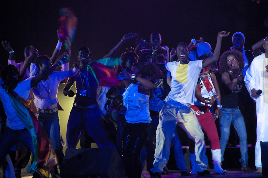 Dakar, Senegal - December 10 -Youth dance while Senegalese singer Ismael Lo (far right) performs at the youth evening event during the first night of the World Festival of Black Arts and Cultures taking place in Dakar, Senegal from December 10 to 31. The festival has brought singers, dancers, artists, writers and more from around the world to celebrate African artists, as well as the diaspora's cultural achievements.