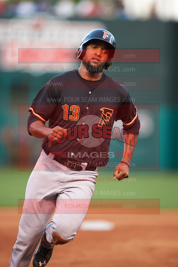 Fresno Grizzles outfielder Domingo Santana (13) running the bases during a game against the Oklahoma City Dodgers on June 1, 2015 at Chickasaw Bricktown Ballpark in Oklahoma City, Oklahoma. Fresno defeated Oklahoma City 14-1. (Mike Janes/Four Seam Images)