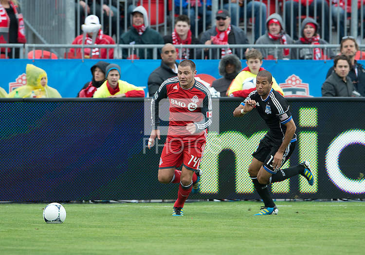 24 March 2012: Toronto FC forward Danny Koevermans #14 and San Jose Earthquakes defender/midfielder Justin Morrow #15 in action during a game between the San Jose Earthquakes and Toronto FC at BMO Field in Toronto..The San Jose Earthquakes won 3-0..