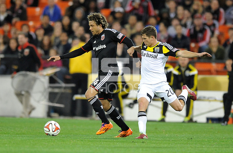 Washington D.C. - March 8, 2014: Nick DeLeon (14) of D.C. United goes against Wil Trapp (20) of the Columbus Crew. The Columbus Crew defeated D.C. United 3-0 during the opening game of the 2014 season at RFK Stadium.