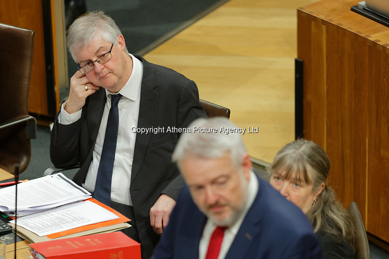 Pictured: First Minister for Wales Carwyn Jones (R) is looked on by successor Mark Drakeford (L). Tuesday 11 December 2018<br />
Re: First Minister for Wales Carwyn Jones during his last First Minister Questions at the Senedd in Cardiff Bay, Wales, UK. He will be succeeded by Assembly Member Mark Drakeford.