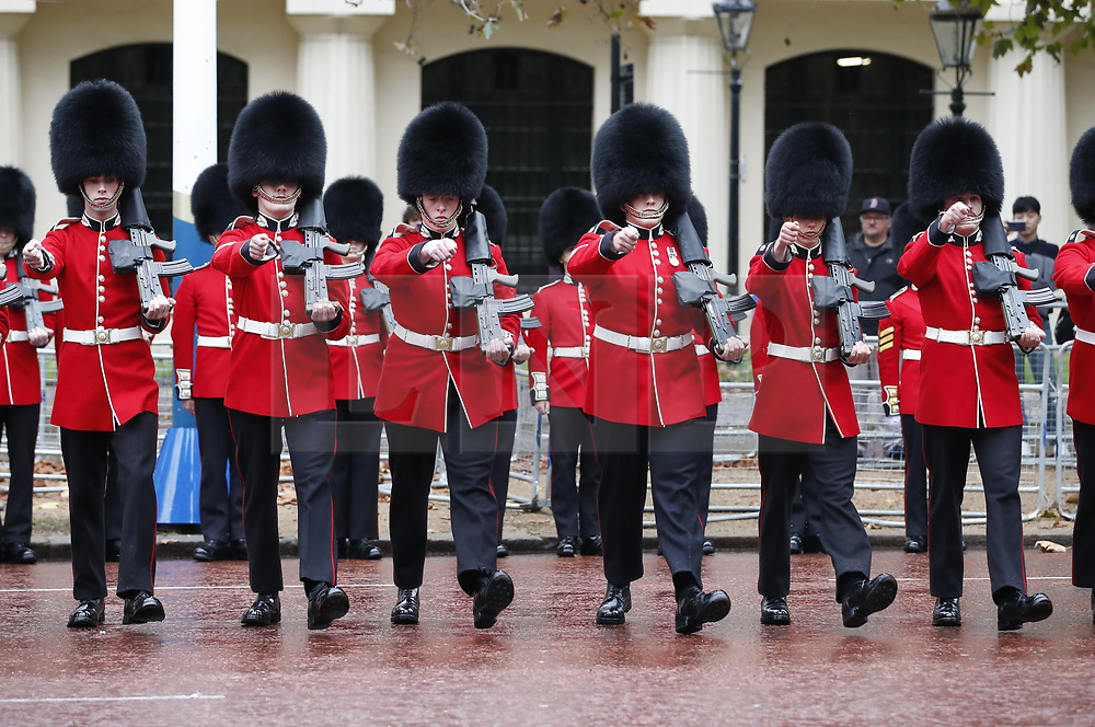 © Licensed to London News Pictures. 14/10/2019. London, UK. Scotts Guards line the route before Queen Elizabeth II rides the Diamond Jubilee Coach along The Mall to The Palace of Westmnster for the State Opening of Parliament. Photo credit: Peter Macdiarmid/LNP