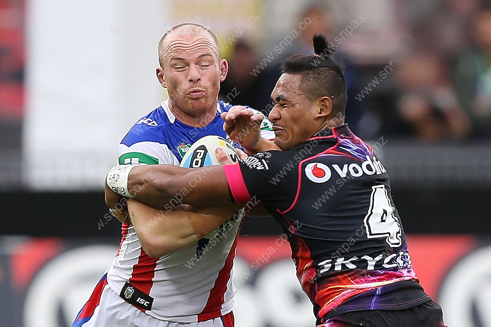 Beau Scott of the Newcastle Knights and Solomone Kata of the New Zealand Warriors clash during their round 12 NRL match at Mount Smart Stadium, Auckland on Sunday, May 31, 2015. Credit: SNPA / David Rowland