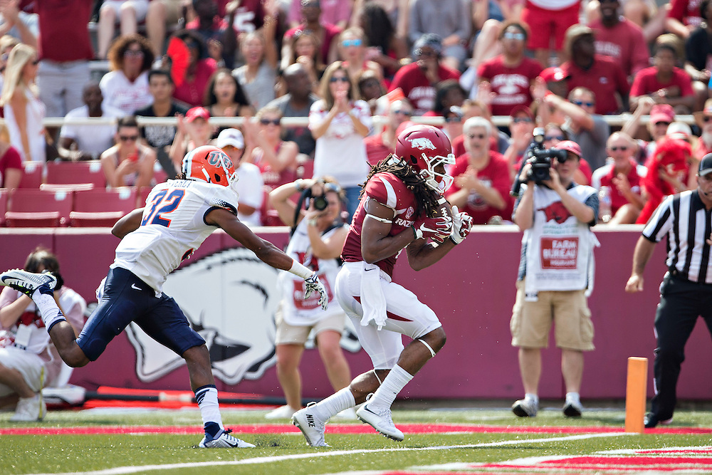 FAYETTEVILLE, AR - SEPTEMBER 5: Keon Hatcher #4 of the Arkansas Razorbacks catches a touchdown pass over Kalon Beverly #32 of the UTEP Miners at Razorback Stadium on September 5, 2015 in Fayetteville, Arkansas. The Razorbacks defeated the Miners 48-13. (Photo by Wesley Hitt/Getty Images) *** Local Caption *** Keon Hatcher; Kalon Beverly