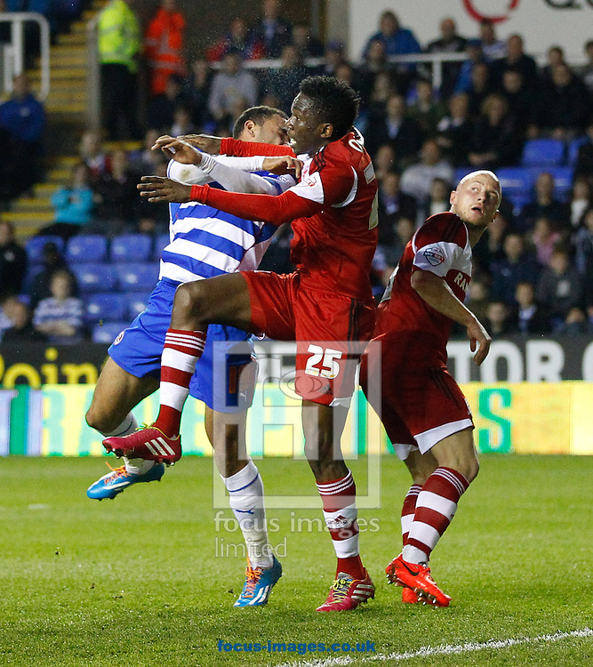 Kenneth Omeruo of Middlesborough (25) connects with Hal Robson-Kanu of Reading injuring his face and resulting in him being substituted after treatment during the Sky Bet Championship match at the Madejski Stadium, Reading<br />
Picture by Andrew Tobin/Focus Images Ltd +44 7710 761829<br />
22/04/2014