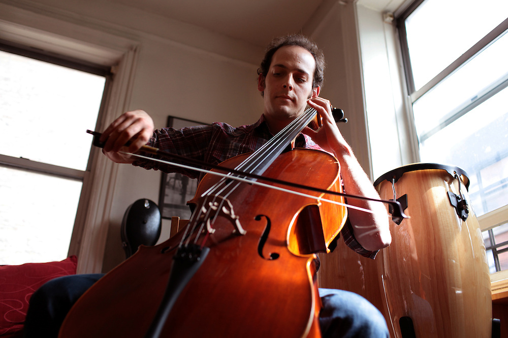 Musician Mike Block in his apartment in Manhattan, New York on May 01, 2011. The Julliard-trained cellist and composer is bringing a new performance series GALA/NYC to the Brooklyn Lyceum in Park Slope..CREDIT: Melanie Burford/Prime for The Wall Street Journal..Slug: NYMIKEBLOCK