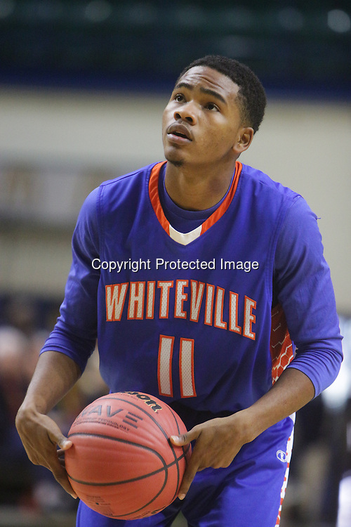 The Ashley High School Boys faced Whiteville High School in the first round of the Leon Brogden Holiday Tournament Saturday December 27, 2014 at UNCW. (Jason A. Frizzelle)