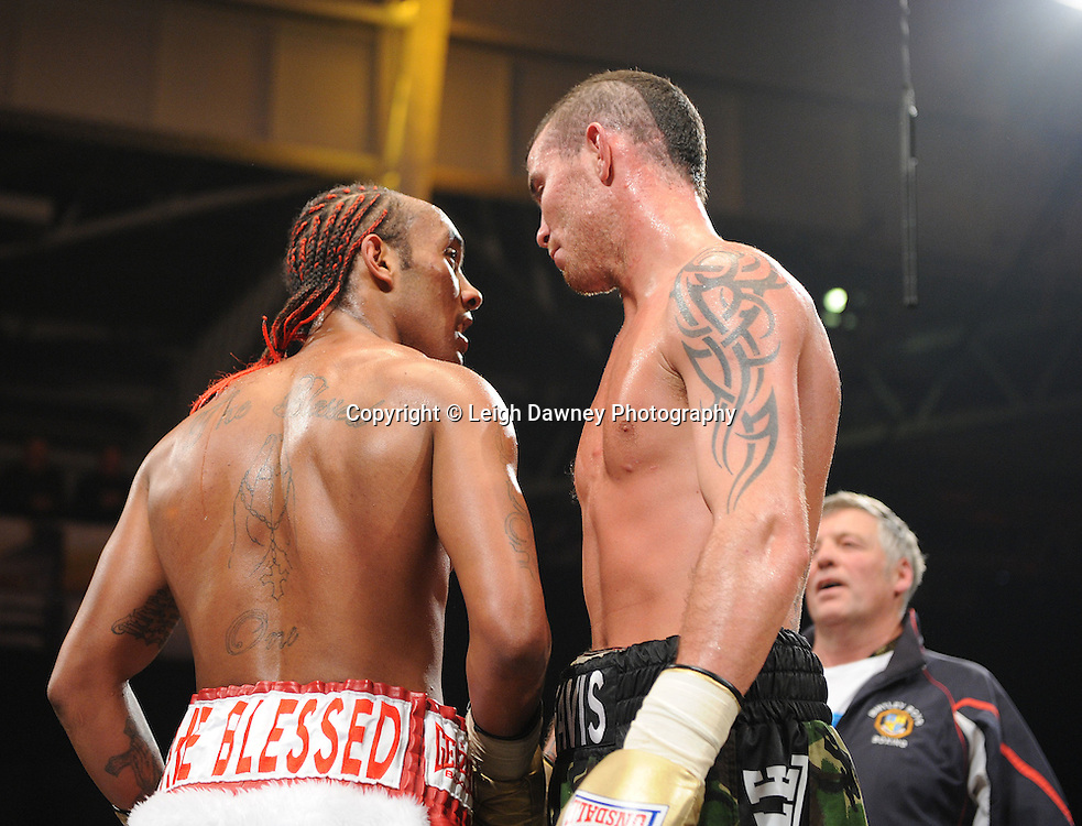 Travis Dickenson (camouflage shorts) defeats Llewellyn Davies (quarter finals) at Prizefighter The Light Heavyweights II, Olympia, London on 29th January 2011. Photo credit © Leigh Dawney.