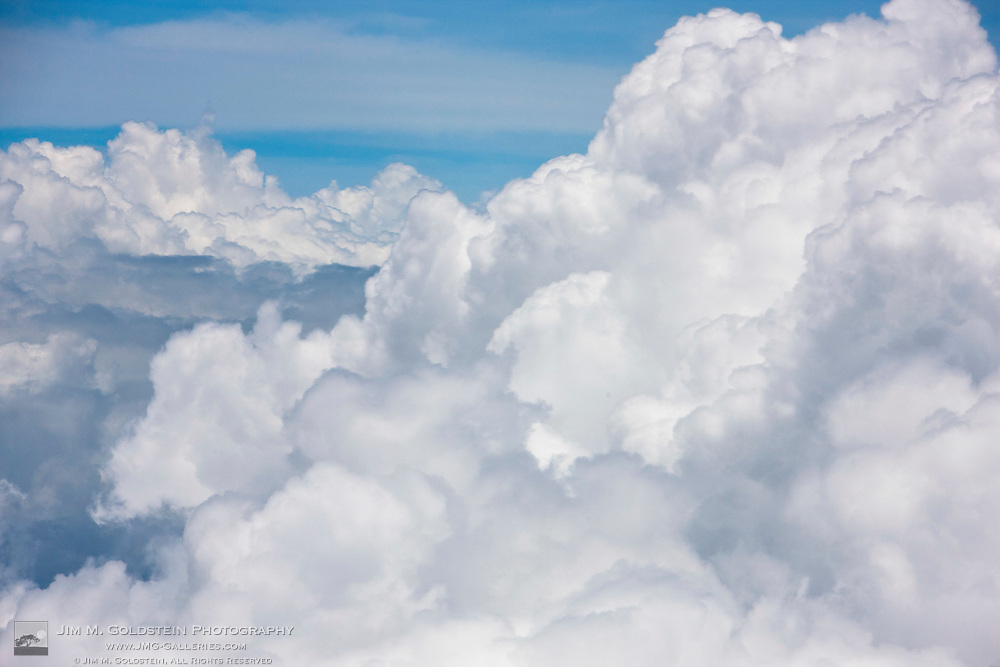 Cumulus clouds as seen from high above the tropical coastline of Costa Rica