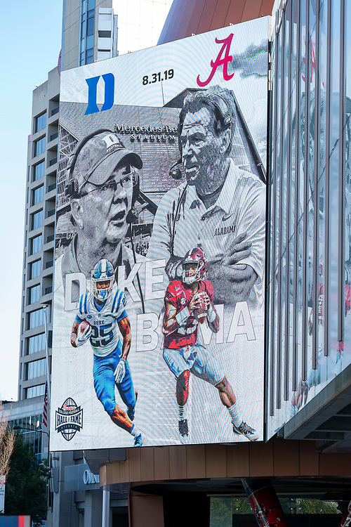 An advertisement for the 2019 Chick-fil-A Kickoff Game between Duke and Alabama appears on the video board outside the College Football Hall of Fame, Friday, August 30, 2019, in Atlanta. (Paul Abell via Abell Images for the Chick-fil-A Kickoff Game)