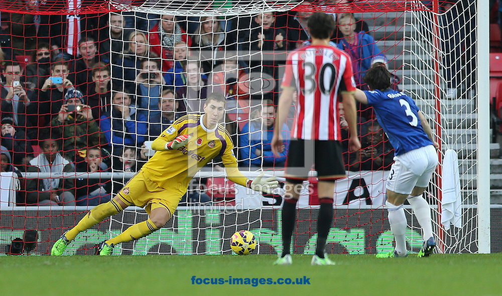 Costel Pantilimon of Sunderland dives the right way but Leighton Baines (r) of Everton equalizes during the Barclays Premier League match at the Stadium Of Light, Sunderland<br />
Picture by Simon Moore/Focus Images Ltd 07807 671782<br />
09/11/2014