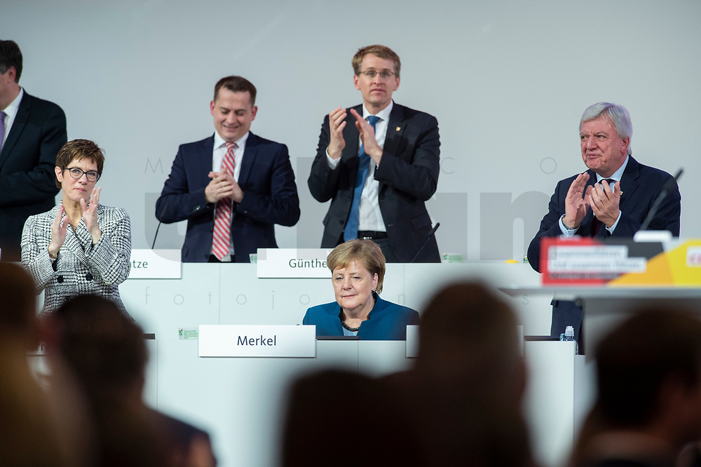 07 DEC 2018, HAMBURG/GERMANY:<br />
Angela Merkel, CDU, Bundeskanzlerin, nach Ihrer letzten Rede als Parteivorsitzende, unten links: Annegret Kramp-Karrenbauer, CDU Generalsekretaerin, unten rechts: Volker Bouvier, CDU, Ministerpraesident Hessen, hinten v.L.n.R.: Dr. Roland Heintze, CDU Landesvorsitzender Hamburg, Daniel Guenther, CDU, Ministerpraesident Schleswig-Holstein, CDU Bundesparteitag, Messe Hamburg<br />
IMAGE: 20181207-01-075<br />
KEYWORDS: party congress, Appluas, applaudiren, klatschen, Jubel, Daniel Günther