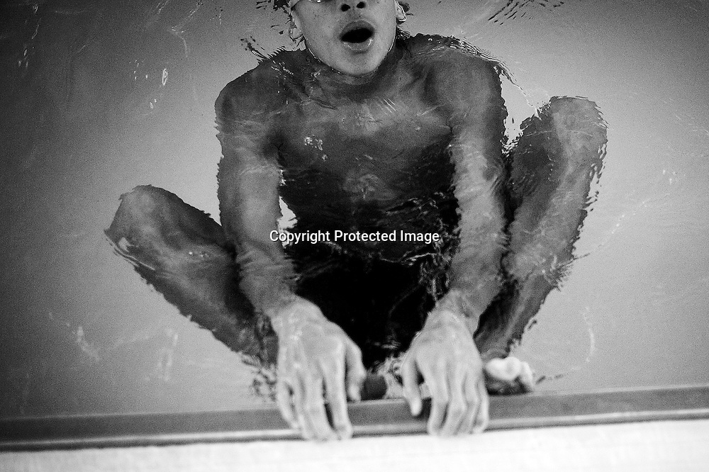 A student practices swimming in the shallow end at a swim class that Jane Katz, a professor at at the John Jay College leads for incarcerated youths at the school's pool in New York, July 17, 2010. Keith Bedford for the New York Times