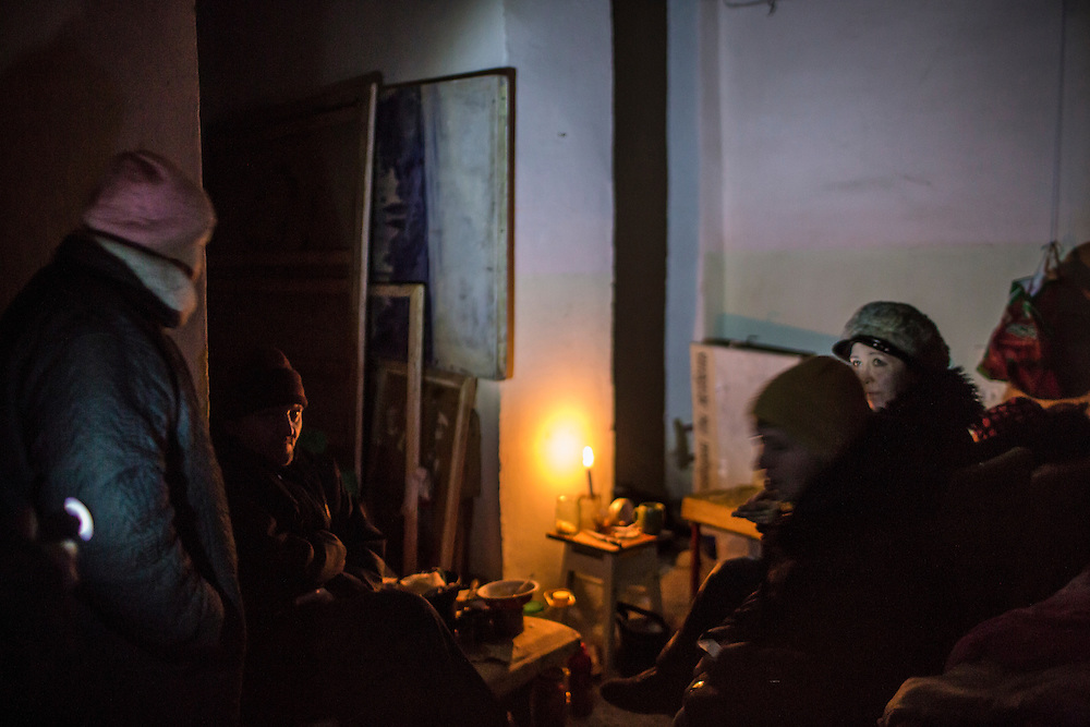 MYRONIVSKYI, UKRAINE - FEBRUARY 17: People sit inside a bomb shelter at the local House of Culture on February 17, 2015 in Myronivskyi, Ukraine. A ceasefire agreed to by Ukraine and pro-Russian rebel forces has failed to prevent fighting in the nearby town of Debaltseve, where thousands of Ukrainian troops remain and whom rebels claim to have surrounded. (Photo by Brendan Hoffman/Getty Images) *** Local Caption ***