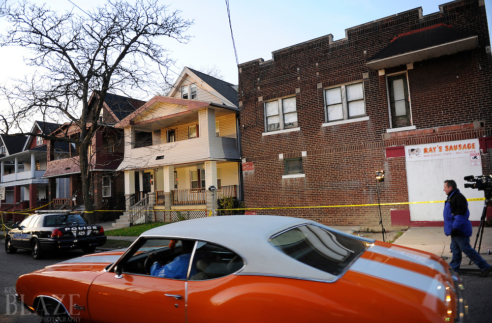 Cleveland police are parked in front of the home of Anthony Sowell at 12205 Imperial Avenue in Cleveland on Wednesday November 4, 2009. Police have discovered as many as 11 bodies in the home as of November 5, 2009...