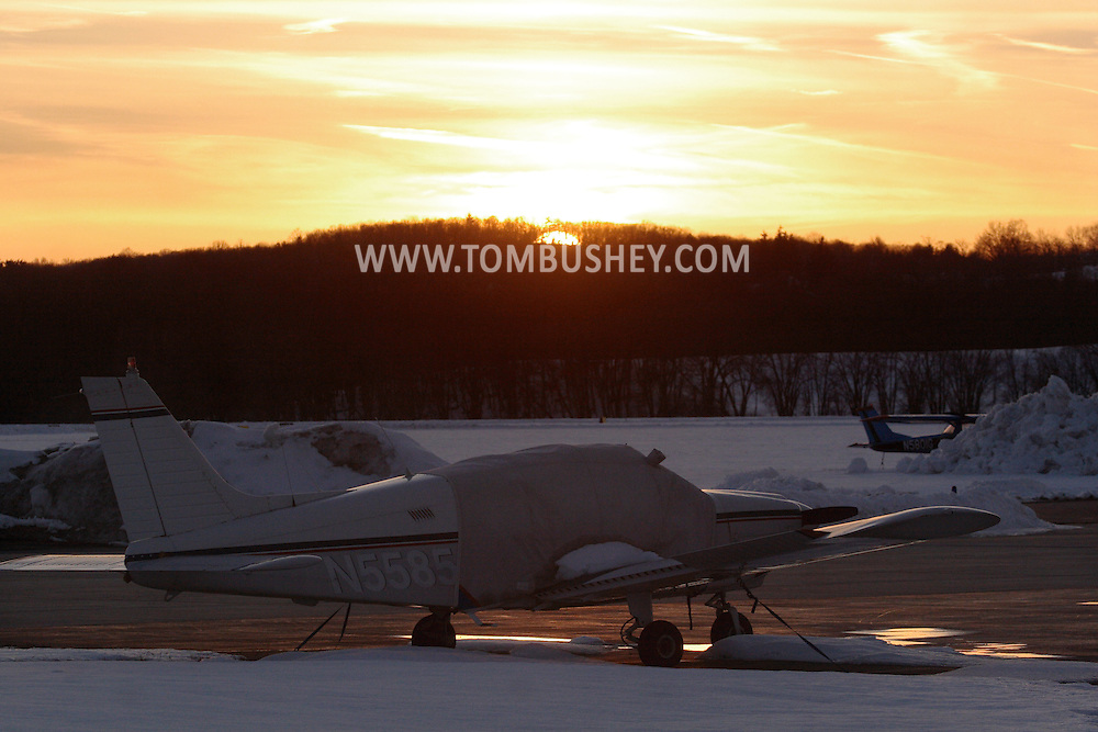 Montgomery, NY - Planes on the tarmac at sunset at Orange County Airport in Montgomery on March 2, 2008.