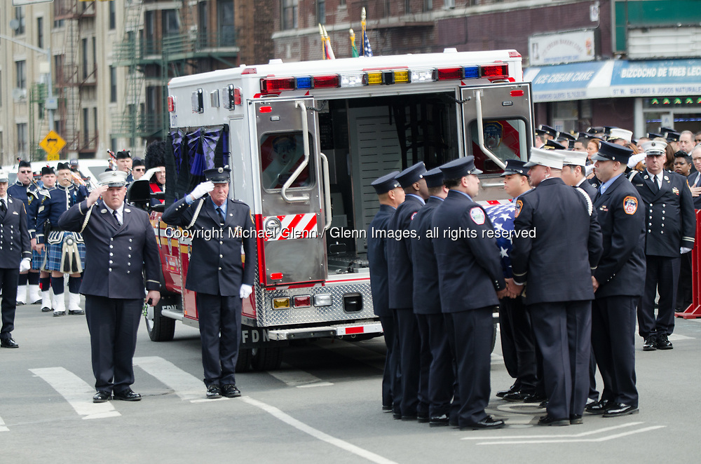 25 Mar 2017 Bronx, New York United States of America // Funeral Service for EMT Yadira Arroyo at FDNYEMS Station 26 at the Saint Nicholas of Tolentine R.C. Bronx. EMT Arroyo, who lived in the Bronx, is survived by her five sons, Jose Montes, 23; Edgar Montes, 22; Kenneth Robles, 19; Justin Robles, 16; and Isaiah Negron, 7; her parents, mother Laida Acevedo-Rosado and father Luis Arroyo, Sr.; her siblings Joell Arroyo and Luis Arroyo, Jr.; and numerous other relatives, including her stepfather Efrain Rosado and nine aunts and uncles. Michael Glenn / Glenn Images