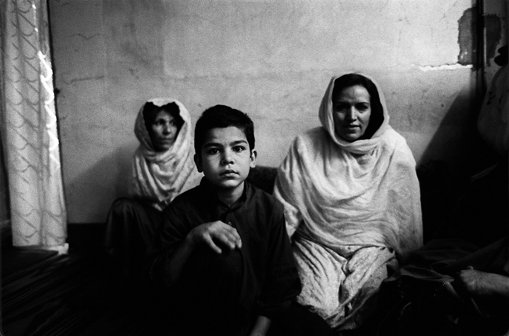 Refugees from Afghanistan living in Peshawar, Pakistan. 2000. Many Afghanies had left their home country due to a continuous state of civil war and foreign occupations. The Taliban that governed Afghanistan in the late 90s and enforced strict rules especially for women also contributed to many people leaving the country.