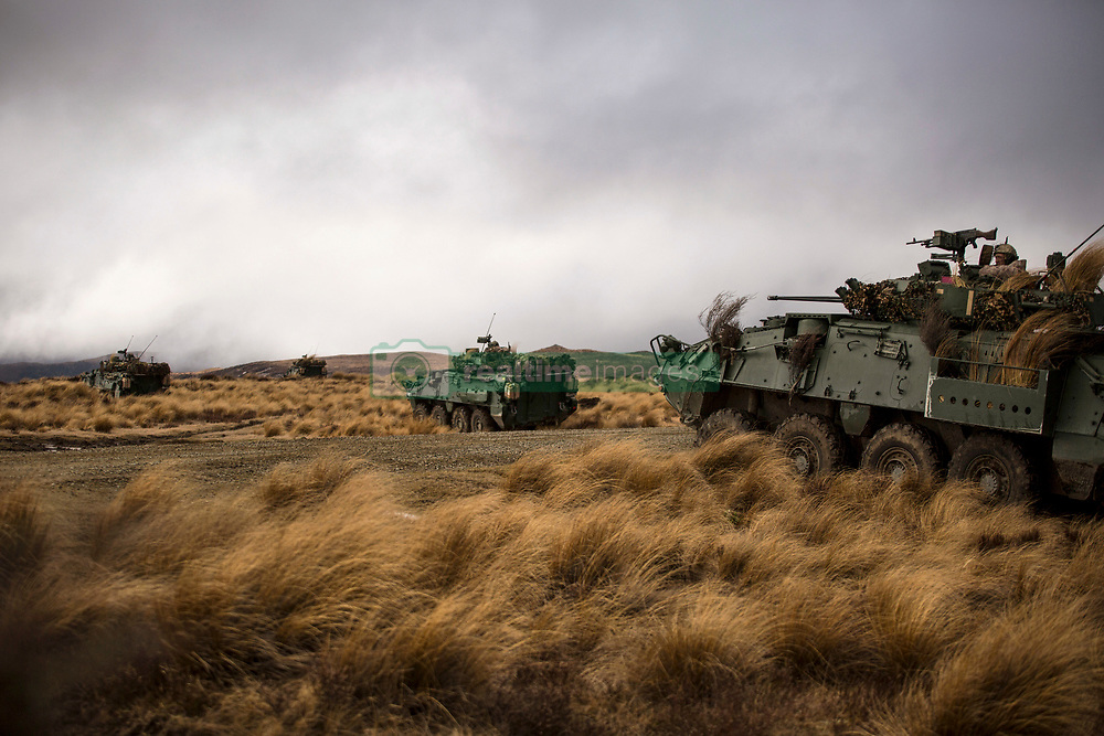 U.S. Marines and Royal New Zealand Army soldiers call for fire from a Light Armoured Vehicle as part of exercise Joint Assault Signals Company Black, Waiouru Military Camp, New Zealand, Sept. 26, 2018. The Marines are with 1st Brigade, 5th Air Naval Gunfire Liaison Company, III Marine Expeditionary Force Information Group. (U.S. Marine Corps photo by Sgt. Jordan E. Gilbert)