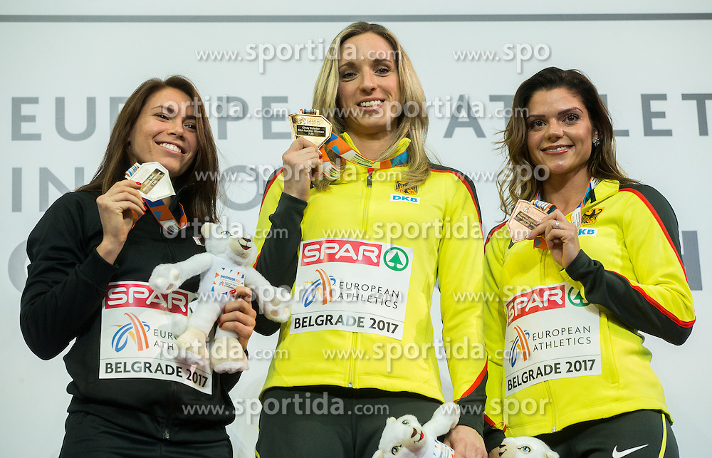 Second placed Alina Talay of Belarus, winner Cindy Roleder of Germany and third placed Pamela Dutkiewicz of Germany celebrate during victory ceremony after competing in the 60 m Hurdles Women Final on day two of the 2017 European Athletics Indoor Championships at the Kombank Arena on March 4, 2017 in Belgrade, Serbia. Photo by Vid Ponikvar / Sportida