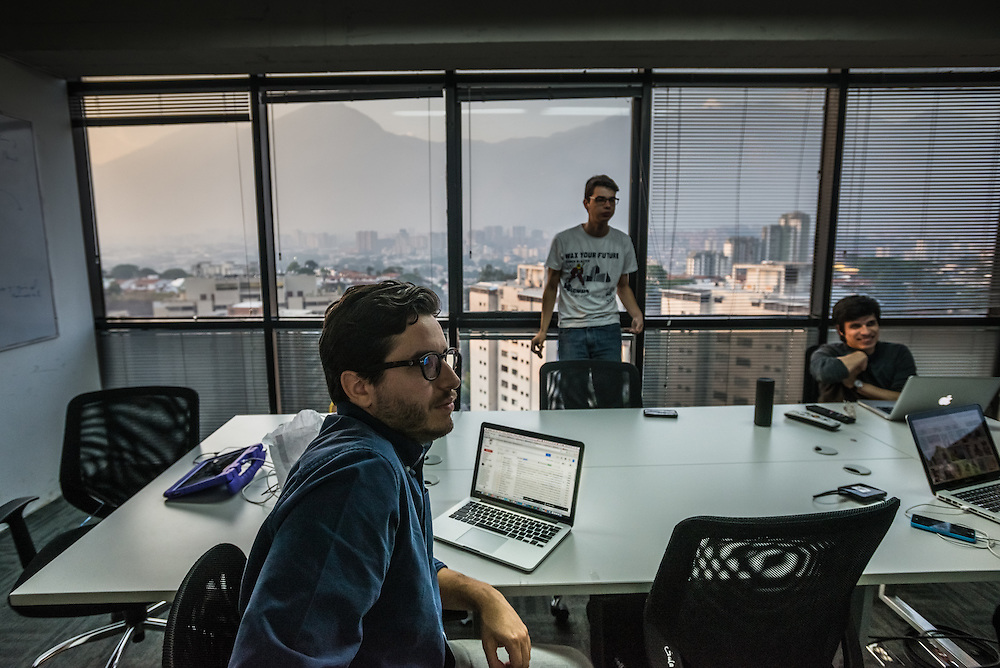 CARACAS, VENEZUELA - MAY 6, 2015: Chigüire Bipolar staff members work on the script of an upcoming episode of the faux news show, "Weekly Report", a comedy sketch led by comedian Rafael Briceño and published on www.elchiguirebipolar.net, commonly referred to as Venezuela's version of www.theonion.com. PHOTO: Meridith Kohut for Buzzfeed News