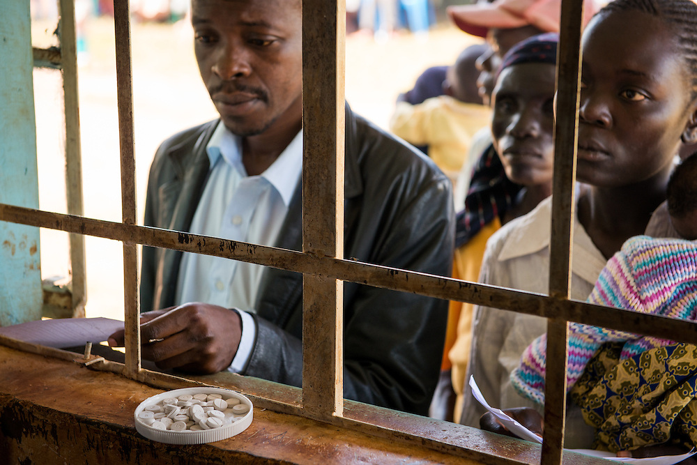 Patients queue at the pharmacy window during the Mercy Medical Team clinic Thursday, June 12, 2014, at the Luanda Doho Primary School in Yala, Kenya. LCMS Communications/Erik M. Lunsford
