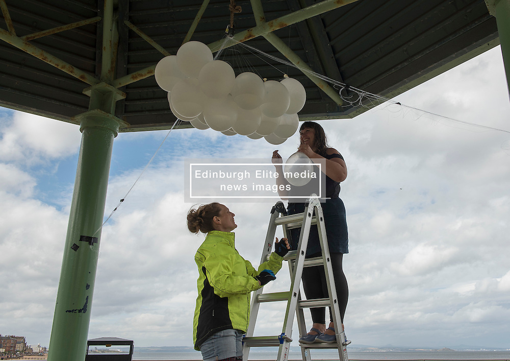 Across Portobello, Edinburgh artists are getting ready for this weekend's Art Walk Porty. A mixture of open studios, pop-up exhibition spaces, artists market and site-specitic art all over the Edinburgh suburb this weekend. The official launch takes place tonight (Thursday) but the event runs from Fri-Sun Sept 2nd-4th. 2016. Pictured: Juliana Capes installs her work at the Joppa Bandstand. <br />
<br />
<br />
© Jon Davey/ EEm