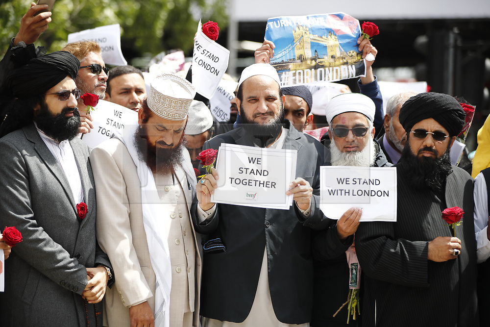 © Licensed to London News Pictures. 07/06/2017. London, UK. Imams and various religious leaders visit the scene of attack on London Bridge and leave flowers for the victims after Saturday night's terror attack that killed 8 people on London Bridge and at Borough Market in central London. Photo credit: Tolga Akmen/LNP