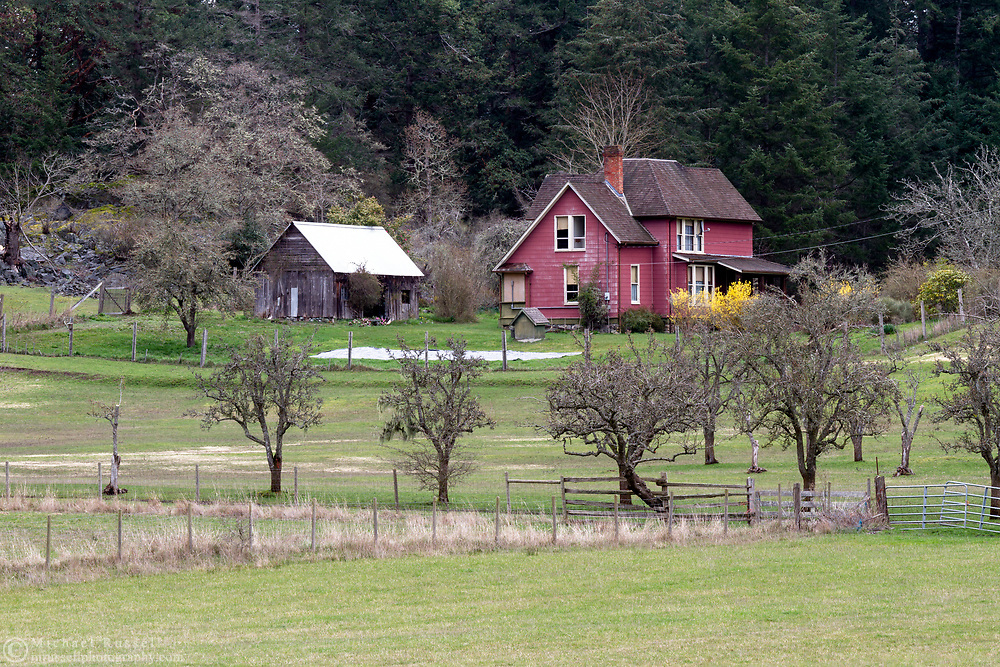 Daniel Henry Ruckle house on the active farmland now in Ruckle Provincial Park on Salt Spring Island, British Columbia, Canada. The Ruckle Farm has been in continuous use as farmland since Henry Ruckle began farming it in 1872. Photographed from Beaver Point Road next to the park headquarters building.