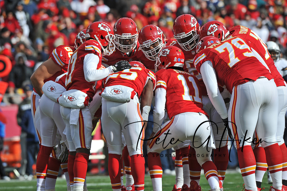 KANSAS CITY, MO - NOVEMBER 24: Quarterback Alex Smith #11 of the Kansas City Chiefs calls out a play in the huddle against the San Diego Chargers during the first half on November 24, 2013 at Arrowhead Stadium in Kansas City, Missouri. (Photo by Peter G. Aiken/Getty Images) *** Local Caption *** Alex Smith