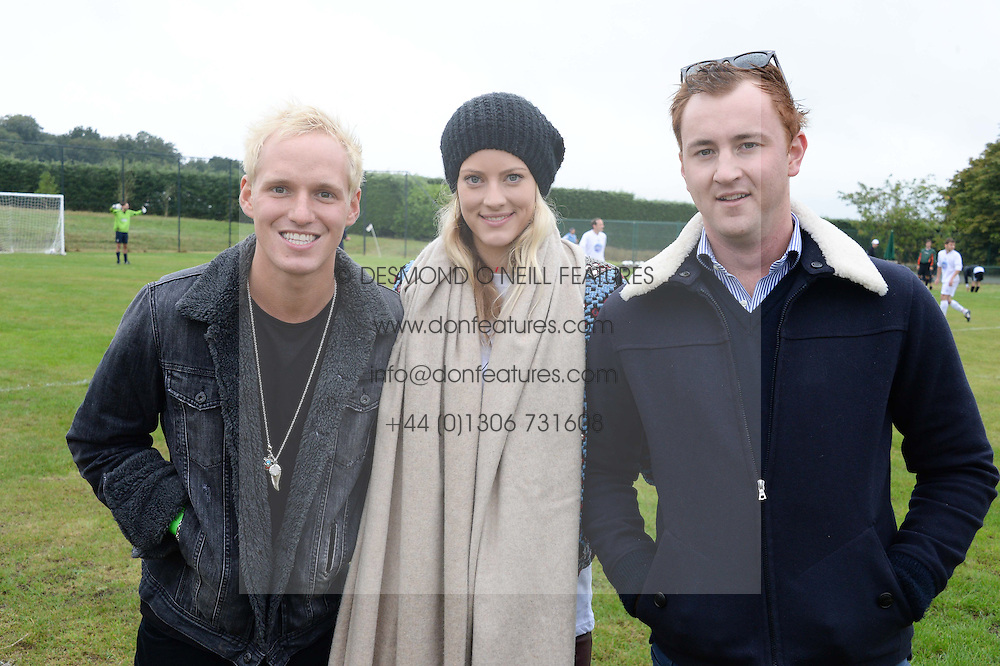 Left to right, JAMIE LAING, CHARLOTTE BAER and FRANCIS BOULE at the Ripley Football Tournament hosted by Irene Forte in aid of The Samaritans held at Ryde Farm, Hungry Hill Lane, Ripley, Surrey on 14th September 2013. After the football guests enjoyed an after party.