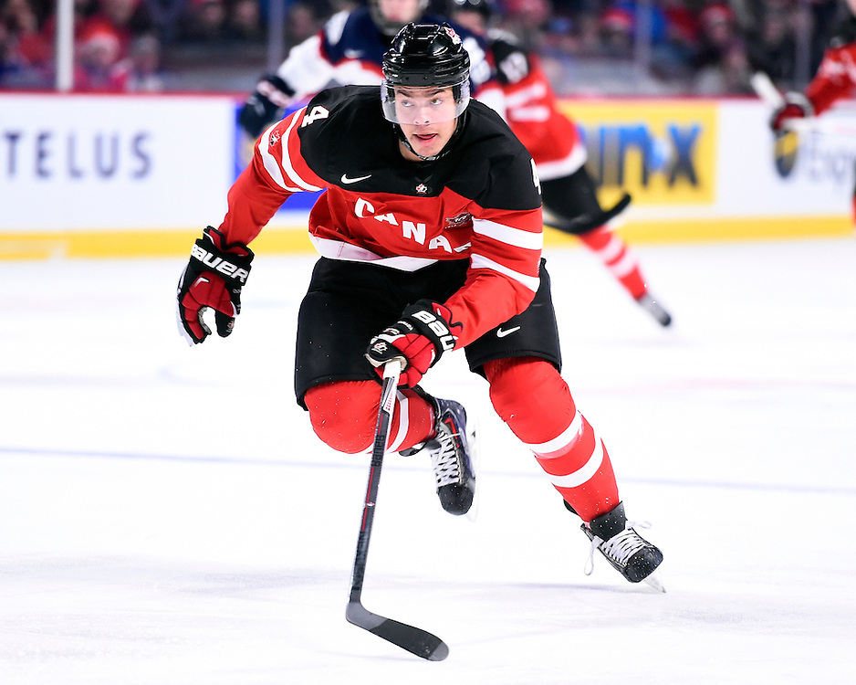 Madison Bowey of the Kelowna Rockets represented Team Canada at the opening game of the 2015 World Junior Championships in Montreal, Quebec on Friday Dec. 26, 2014. Canada defeated Slovakia 8-0. Photo by Aaron Bell/CHL Images.
