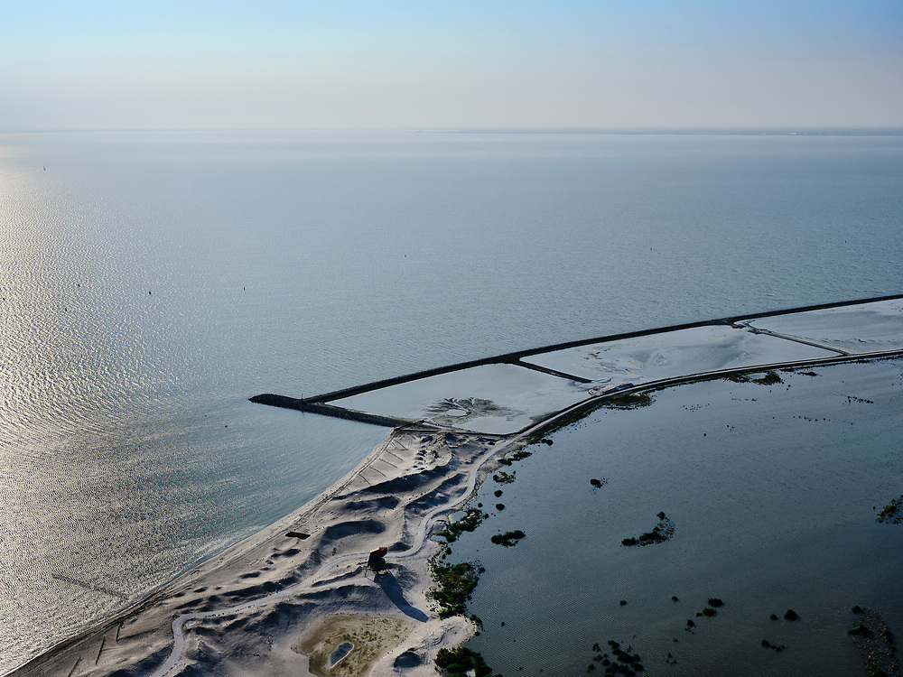 Nederland, Flevoland, Markermeer, 26-08-2019; Marker Wadden in het Markermeer. Westelijk deel archipel.<br />
Doel van het project van Natuurmonumenten en Rijkswaterstaat is natuurherstel, met name verbetering van de ecologie in het gebied, in het bijzonder de kwaliteit van bodem en water<br />
Naast het hoofdeiland is er inmiddels een tweede eiland in wording, de uiteindelijk Marker Wadden archipel zal uit vijf eilanden bestaan. <br />
Marker Wadden, artifial islands. The aim of the project is to restore the ecology in the area, in particular the quality of soil and water.<br />
The first phase of the construction, the main island, is finished. <br />
<br />
luchtfoto (toeslag op standard tarieven);<br />
aerial photo (additional fee required);<br />
copyright foto/photo Siebe Swart