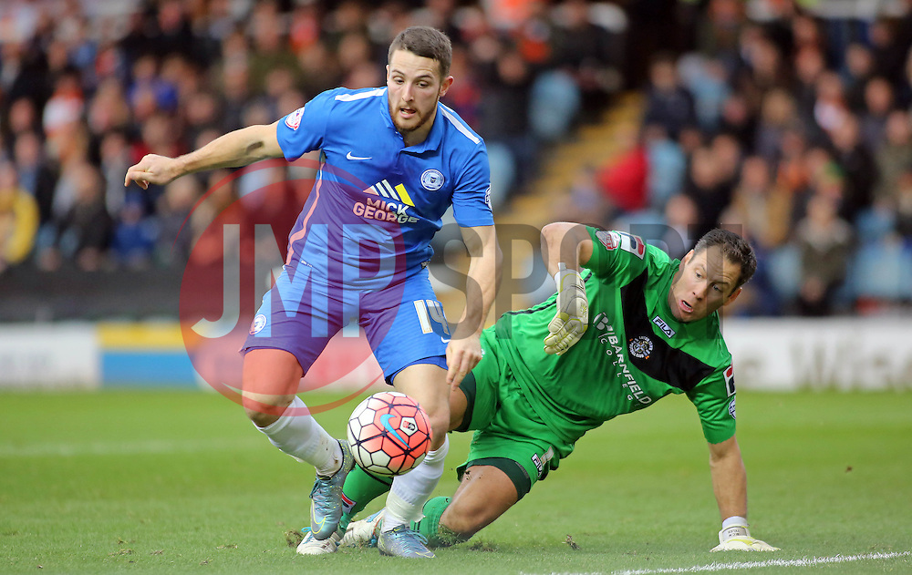 Conor Washington of Peterborough United holds off Mark Tyler of Luton Town - Mandatory byline: Joe Dent/JMP - 06/12/2015 - Football - ABAX Stadium - Peterborough, England - Peterborough United v Luton Town - FA Cup