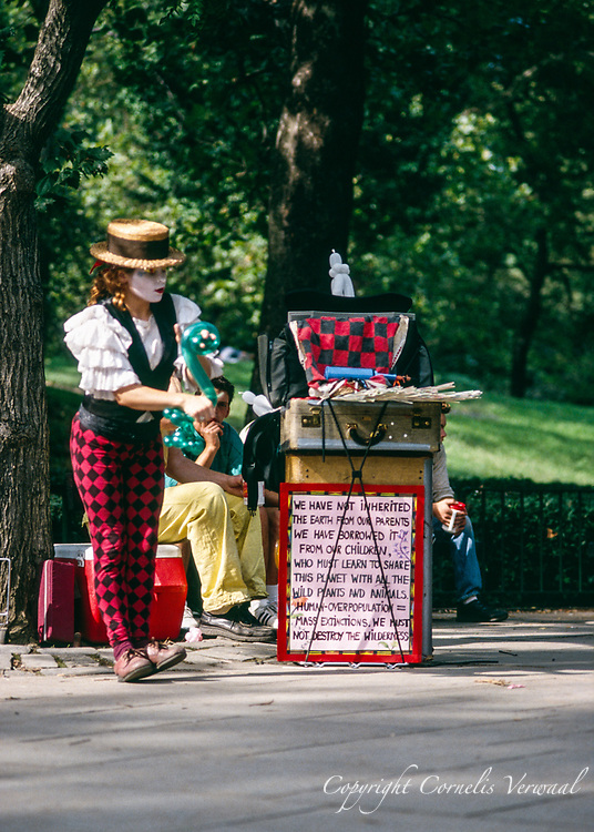 A magical dancing show with Professor Bendeasy & Miss Ooula-La at the statue of Alice in Wonderland in Central Park, New York City, 1992.