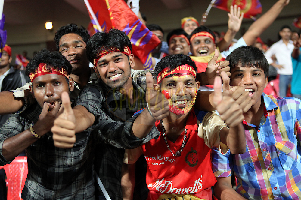 Fans enjoy the CLT20 atmosphere during match 16 of the NOKIA Champions League T20 ( CLT20 ) between the Royal Challengers Bangalore and Somerset held at the M.Chinnaswamy Stadium in Bangalore , Karnataka, India on the 3rd October 2011..Photo by Ron Gaunt/BCCI/SPORTZPICS