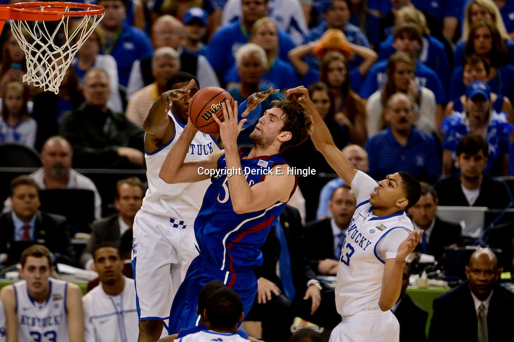 Apr 2, 2012; New Orleans, LA, USA; Kansas Jayhawks center Jeff Withey (5) goes up for a shot as Kentucky Wildcats forward Terrence Jones (behind) and forward Anthony Davis (23) defend during the first half in the finals of the 2012 NCAA men's basketball Final Four at the Mercedes-Benz Superdome. Mandatory Credit: Derick E. Hingle-US PRESSWIRE