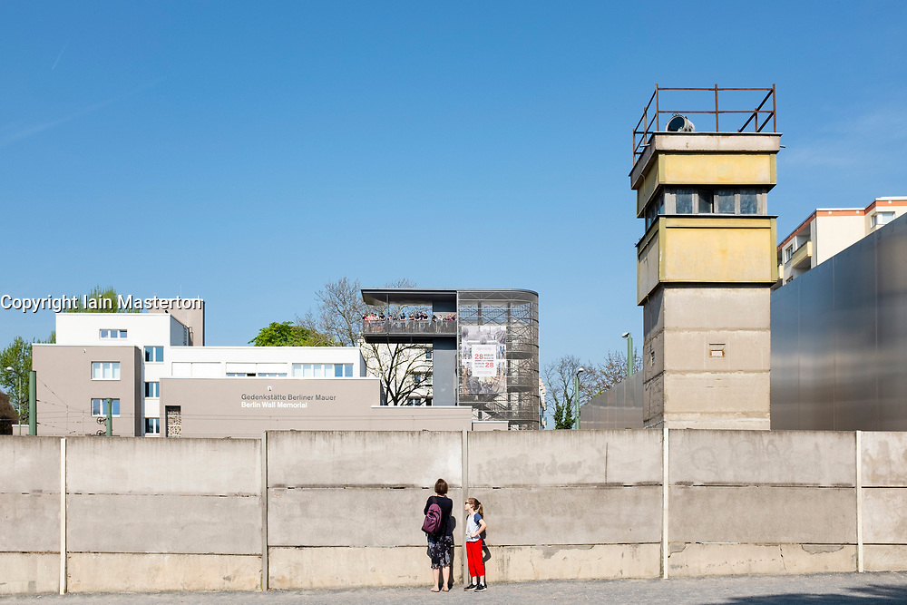 Reconstructed section of Berlin Wall with death strip and guard-tower at Berlin Wall Memorial on Bernauer Strasse , Berlin, Germany. The Gedenkstätte Berliner Mauer commemorates the division of Berlin by the Berlin Wall and the deaths that occurred there. The monument was created in 1998 by the Federal Republic of Germany and the Federal State of Berlin.