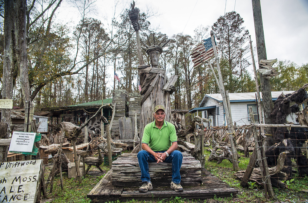 Adam Morales in his yard that is part of Adam’s Cypress Swamp Driftwood Family Museum in Pierre Part, Louisiana, which he created.