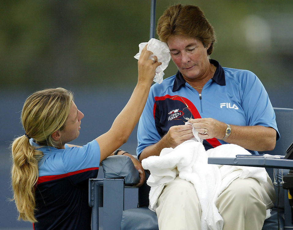 Chair umpire Lynn Welch of the US is helped by a ballgirl after she was stuck in the face by a ball thrown by a ballperson during the match between Ai Sugiyama of Japan and Francesca Schiavone of Italy Thursday 04 September, 2003 at the US Open in Flushing Meadows, NY. Andrew GOMBERT//
