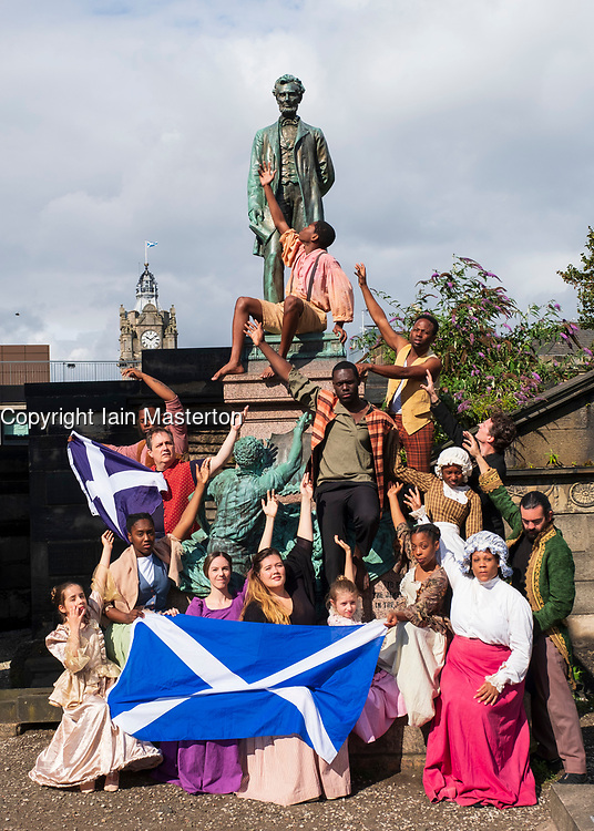Edinburgh, Scotland, UK; 1 August, 2018. The cast of Henry Box Brown: a Musical Journey at the statue of President Lincoln in the Old Calton Burial Ground, Edinburgh. New York Gospel singers from a new Edinburgh Fringe musical about an American slave shipped to freedom in a 3ftX2ft box gather at American Civil War Memorial to honour the Scots who fought against slavery in the American Civil War.