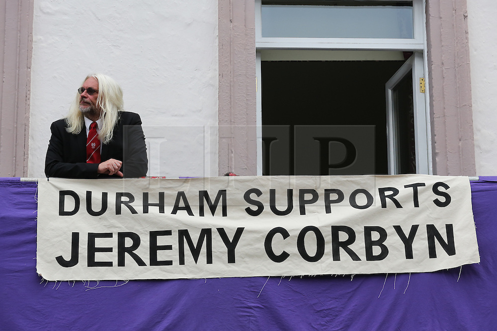 © Licensed to London News Pictures. 09/07/2016. Durham, UK. A man stands next to a large banner supporting Labour leader Jeremy Corbyn at the Durham Miners' Gala in County Durham, UK. The gala is a large gathering held annually associated with the coal mining heritage and trade unionism. Photo credit : Ian Hinchliffe/LNP