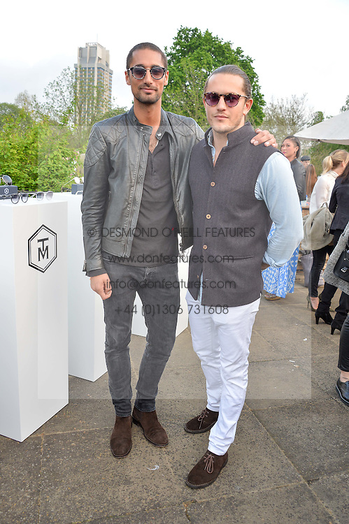 Left to right, HUGO TAYLOR and CHARLIE MORRIS at a party to launch the Taylor Morris Explorer Collection held at the Serpentine Lido, Hyde Park, London on 11th May 2016.