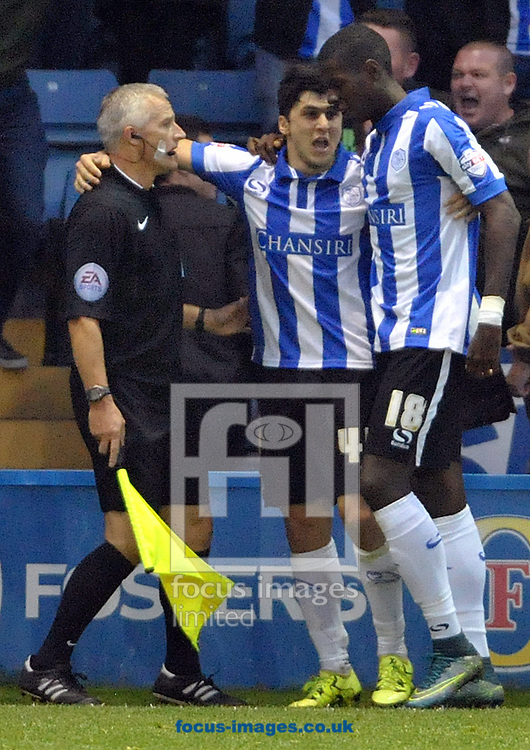 Fernando Forestieri (centre) of Sheffield Wednesday celebrates his goal against Nottingham Forest with the assistant referee during the Sky Bet Championship match at Hillsborough, Sheffield<br />
Picture by Graham Crowther/Focus Images Ltd +44 7763 140036<br />
31/10/2015