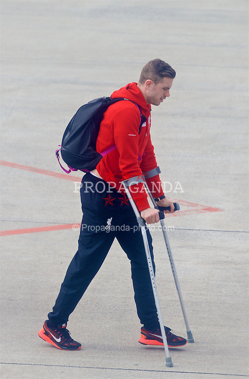 DORTMUND, GERMANY - Friday, April 8, 2016: Liverpool's captain Jordan Henderson departs Dortmund Airport on crutches after sustaining a knee injury during his side's UEFA Europa League Quarter-Final 1st Leg match against Borussia Dortmund last night. (Pic by David Rawcliffe/Propaganda)